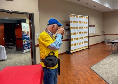 man taking photos at Heartland Caregiving Conference