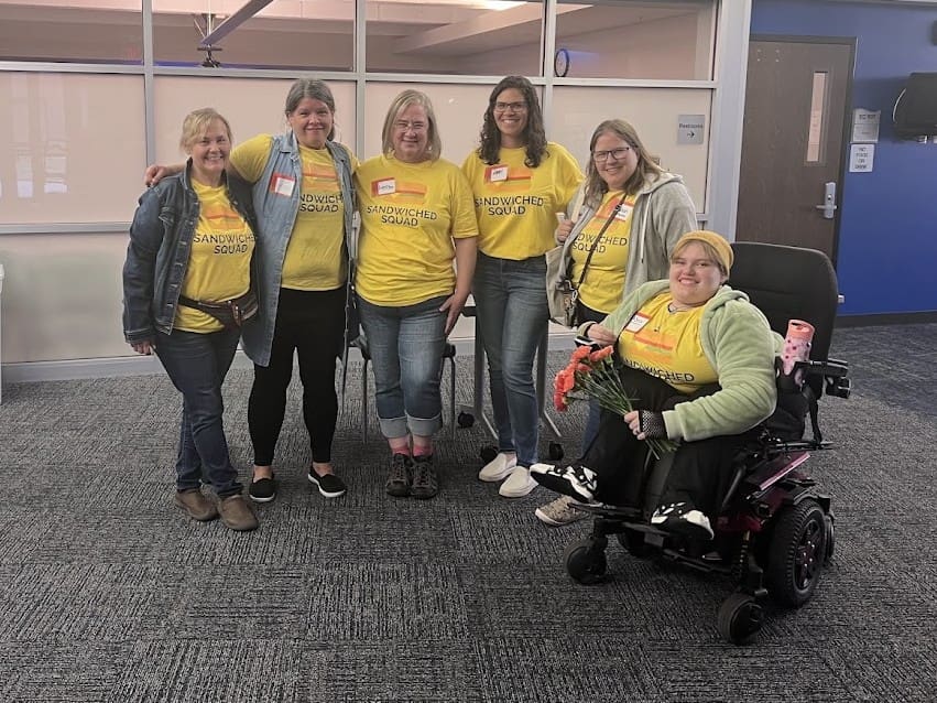 Group of volunteers wearing yellow shirts