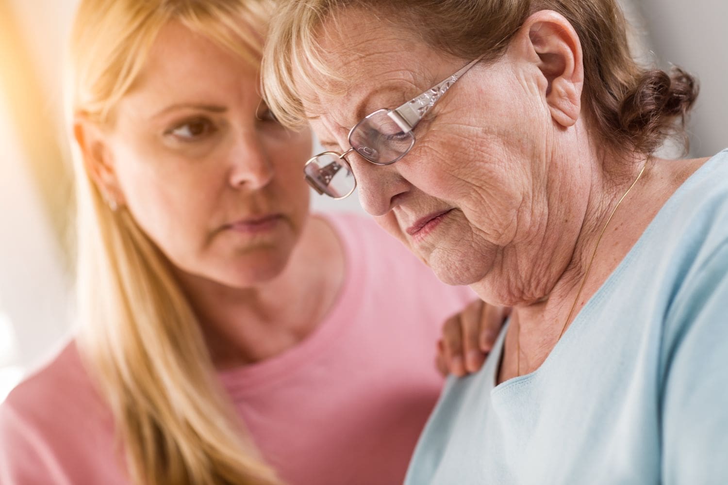 woman looking at older woman