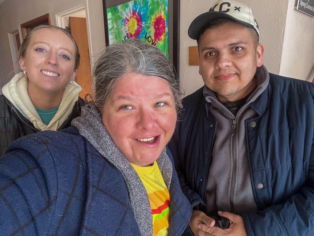 A group of volunteers posing for a photo at the swap